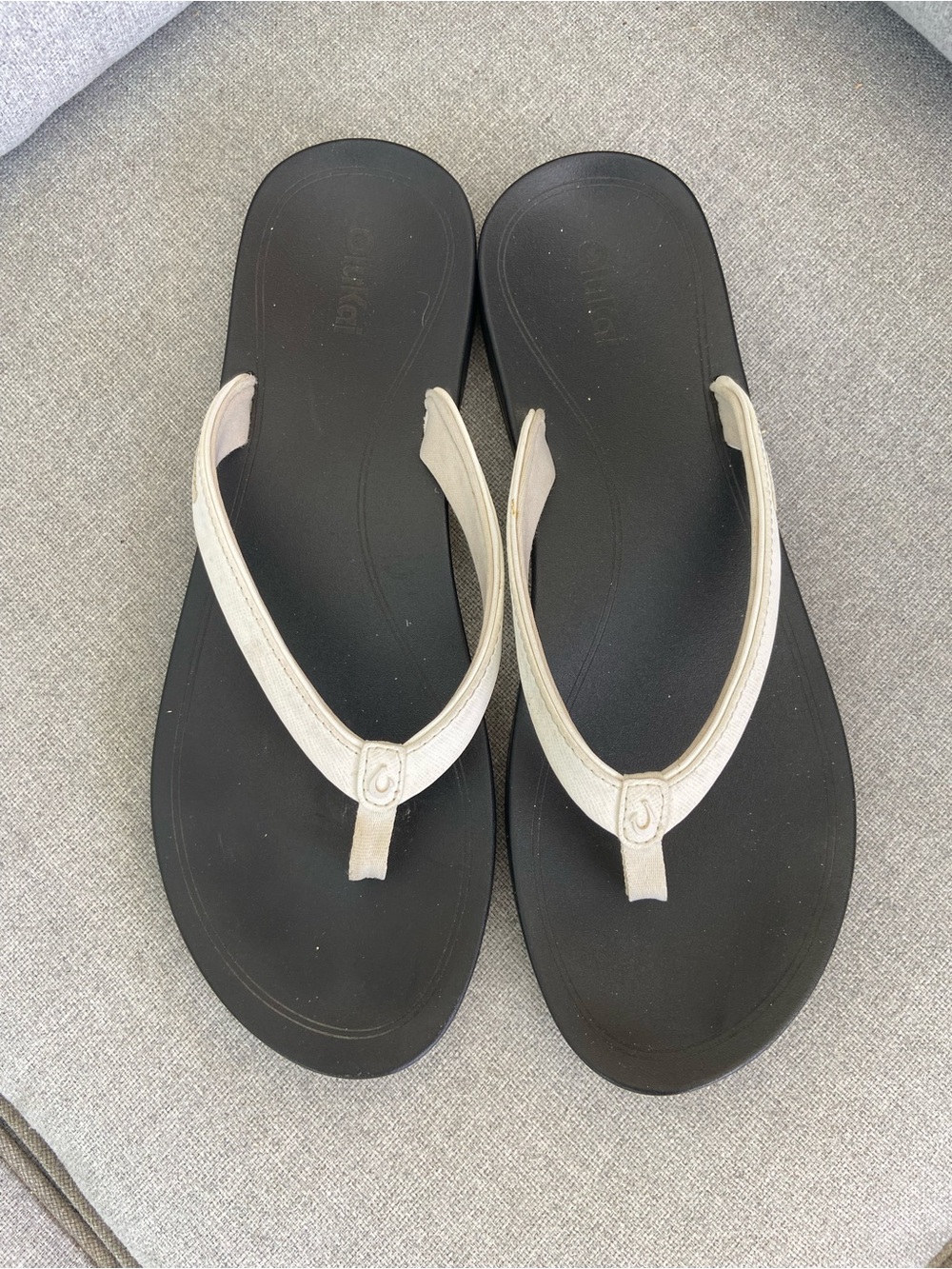 OluKai Black Footbed Sandals with Cream Straps